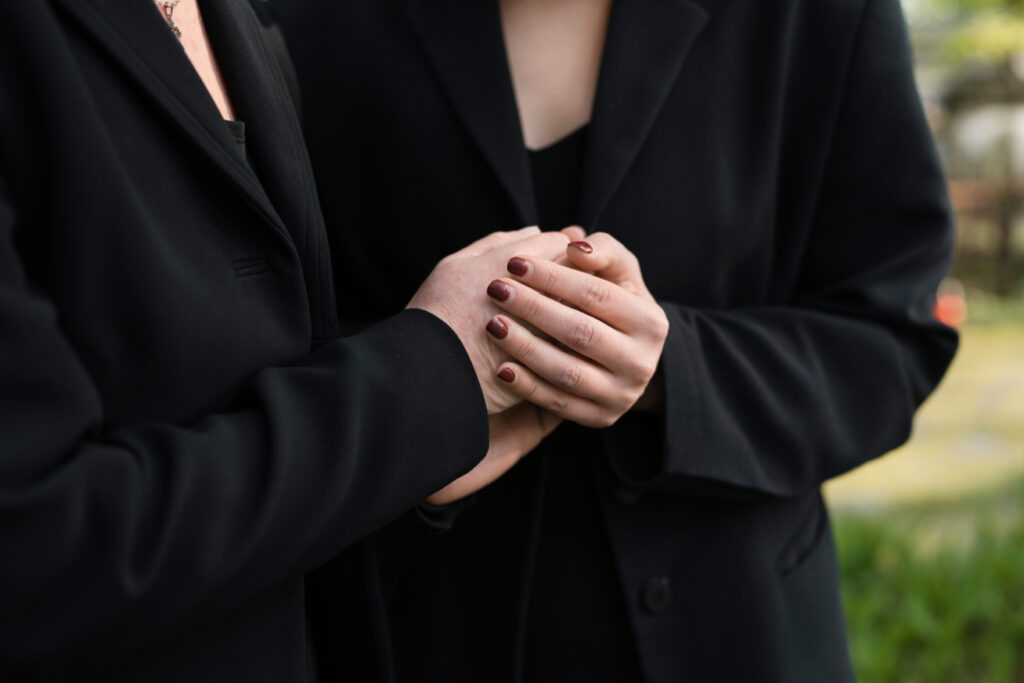 a mourning mother daughter grave cemetery